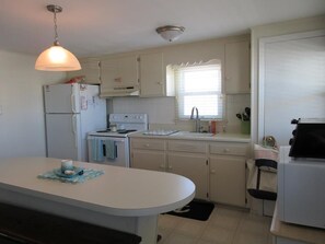 Fridge, microwave, oven, stovetop - recently updated second floor duplex located on the ocean block in Surf City. (Surf City)