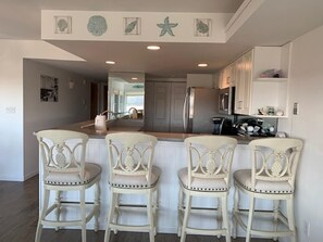 Fridge, stovetop, dishwasher, coffee/tea maker