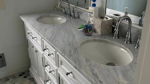A bathroom with two sinks, a large mirror, and a window with blinds. - Beautiful Private Ocean Front Home (Loveladies)