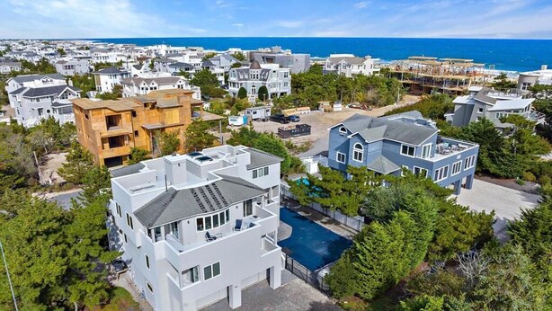 A residential area with houses, a swimming pool, and a view of the ocean. - 6 BEDROOMS ON PRIVATE LANE! (Loveladies)