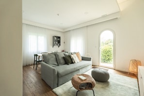 Standard House, Air conditioning, Garden View | Living area | Flat-screen TV