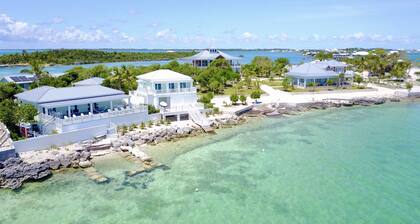 Luxury oceanfront 4BR · 2 protected docks · private gated compound