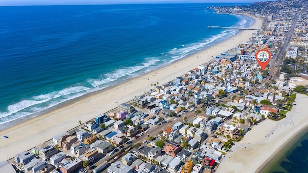 An aerial view of a coastal town with a beach, residential buildings, and a pier. - Zanzibar Retreat 2BR | Walk to Beach! + Courtyard (San Diego)