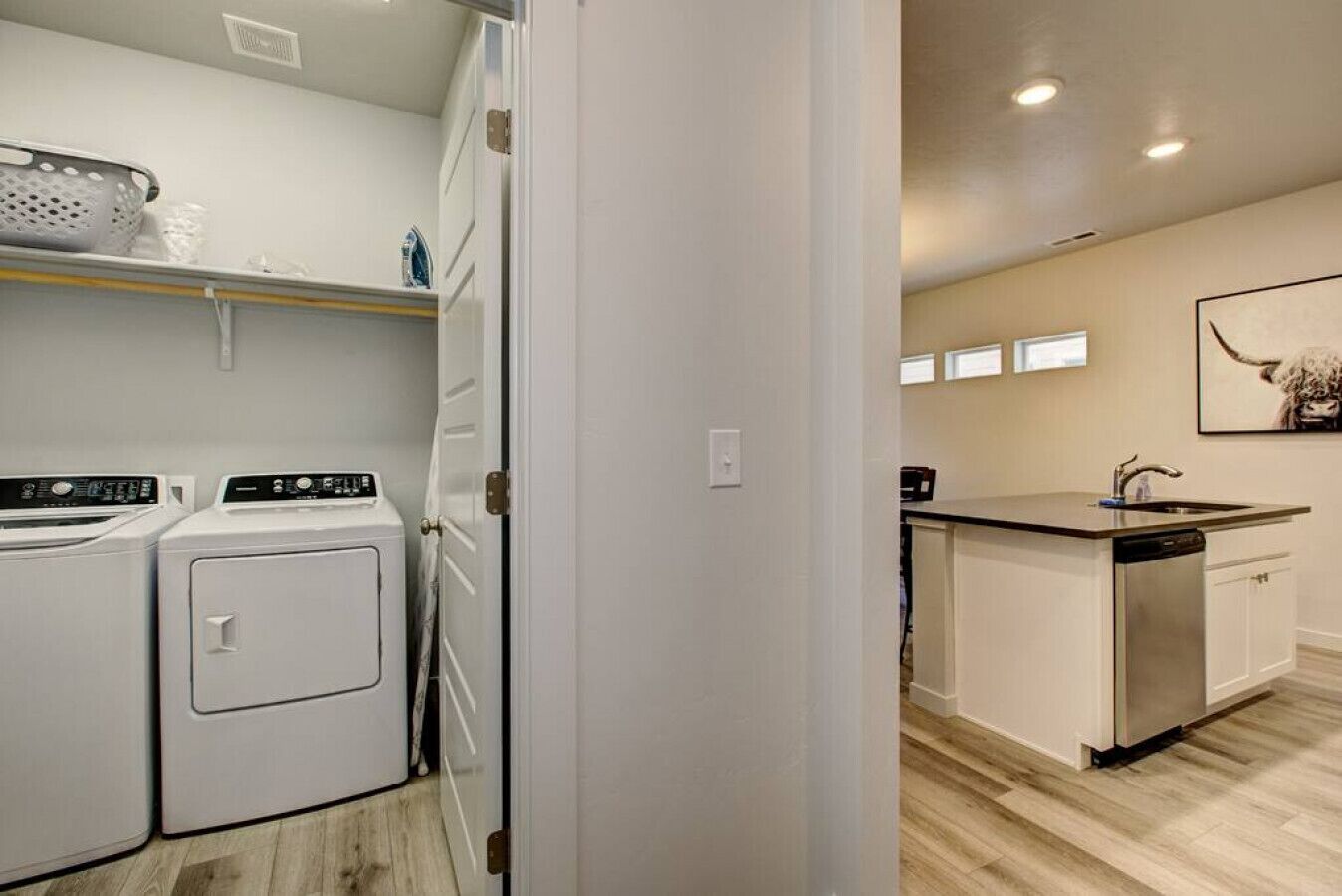 A compact kitchen with a dishwasher, a sink, and a countertop.