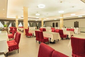 A banquet hall with tables and chairs arranged for events. - Cotton Rose Hotel (Cili)