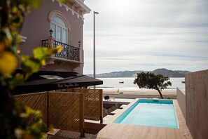 Outdoor pool, open 7:30 AM to 9:00 PM, pool loungers