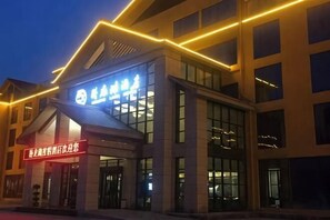 A building with a prominent sign and large windows. - Suiyang Wolong Lake Resort (Suiyang)