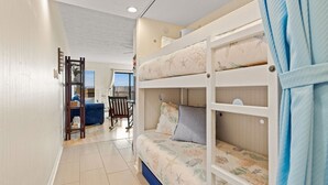 A bunk bed room with a view of the outside. - Duckburgh - Ocean view, Updated, 2 min. walk to the beach (Kitty Hawk)