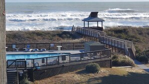 A beachside pool area with a gazebo, a wooden deck, and a view of the ocean. - Duckburgh - Ocean view, Updated, 2 min. walk to the beach (Kitty Hawk)