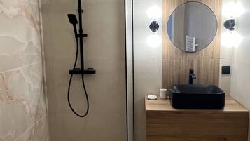 Shower, hair dryer, towels, soap