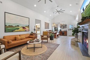 Smart TV, fireplace, books, printers