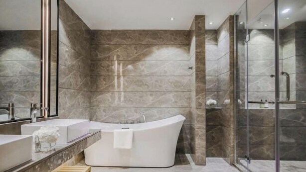 A modern bathroom with a freestanding bathtub, two sinks, and a glass shower enclosure. - Joy Hotel Hangzhou (Hangzhou)