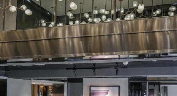 A modern interior with a metallic ceiling and pendant lighting. - Joy Hotel Hangzhou (Hangzhou)
