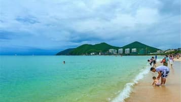 Guests can enjoy a beachside retreat with turquoise waters and a sandy shore.