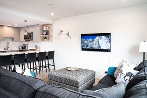 Condo | Living area | 32-inch flat-screen TV with digital channels, TV, streaming services - Switchback Suite by Revelstoke Vacations (Revelstoke)