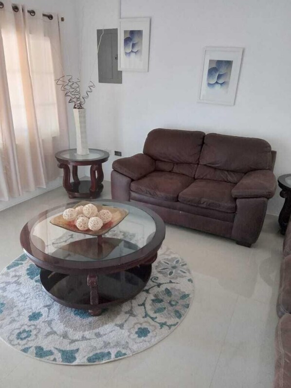 Family Villa | Living area | 32-inch Smart TV with digital channels, TV, streaming services