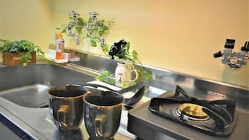 Fridge, microwave, stovetop, cookware/dishes/utensils