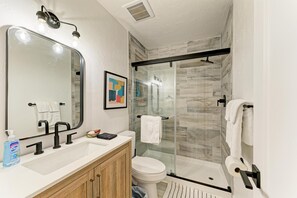 Shower, hair dryer, towels, soap