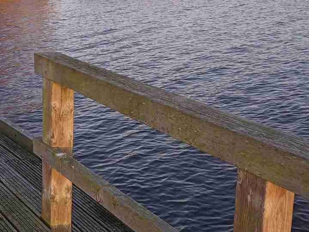 A wooden dock extending over a body of water.