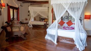Deluxe Double Room, Ocean View, Beachfront | Minibar, in-room safe, free WiFi, bed sheets
