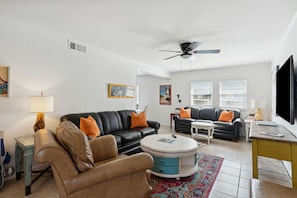 The hipster chic vibe and décor of the large living area allow for a fun yet relaxed feel in the home. The living area has a large TV and comfortable Queen sleeper sofa