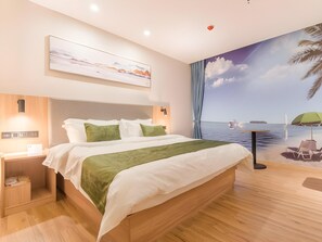 A modern hotel room with a large bed, a nightstand, a wall-mounted control panel, and a mural of a beach scene. - Greentree Inn Hefei Binhu Century City Binhu Hospital (Hefei)