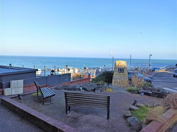 Stroll along the seaside promenade, taking in the views of the ocean from the low stone wall.