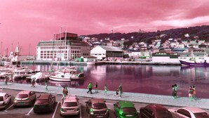 A marina with boats docked, a large building, and a hilly landscape in the background. - Norwegian Stern - Fecamp (FECAMP)
