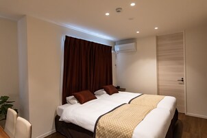 Basic Apartment | Desk, laptop workspace, blackout drapes, iron/ironing board