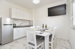 Fridge, stovetop, coffee/tea maker, cookware/dishes/utensils