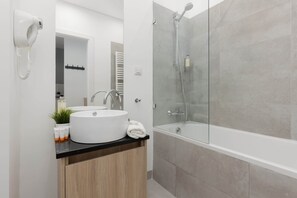 Bathtub, hair dryer, towels