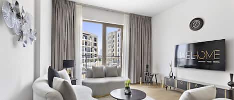ดีลักซ์อพาร์ทเมนท์ | บริเวณนั่งเล่น | สมาร์ททีวี 65 นิ้ว พร้อมช่องเคเบิล, ทีวี, Netflix
