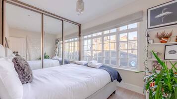 1 bedroom, laptop workspace, bed sheets