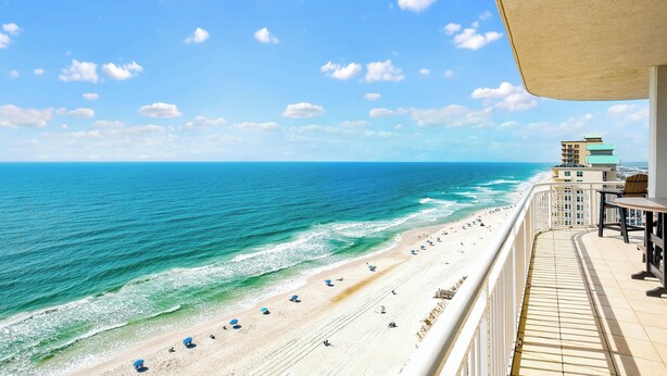 A balcony with a view of a beach and ocean. - NEW RENTAL-Oceania 13-Luxury 4000 SQ FT Gulf Front Condo-Signature Properties (Gulf Shores)