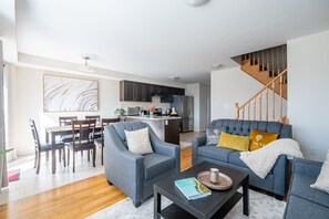 Elite Townhome, 3 Bedrooms, Patio, City View | Living area | 42-inch flat-screen TV with cable channels, TV, Netflix - New 3BR Townhouse, Minutes to Niagara Falls and Brock University by GLOBALSTAY (Thorold)