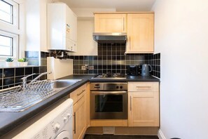 Fridge, microwave, toaster, cookware/dishes/utensils