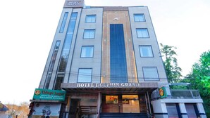 A multi-story hotel with a prominent sign reading "HOTEL DOLPHIN GRAND". - HOTEL DOLPHIN GRAND  (Varanasi)