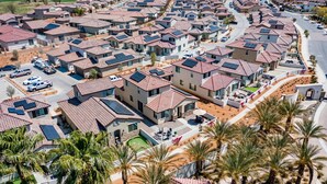 A residential area with multiple houses, each featuring red-tiled roofs and solar panels. - PGA West Luxury Villa/palm Springs:Golf,Pool,Fitness center (La Quinta)
