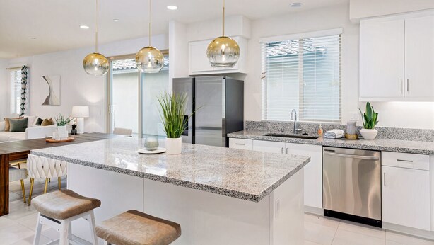 A modern kitchen with a granite countertop, stainless steel appliances, and pendant lighting. - PGA West Luxury Villa/palm Springs:Golf,Pool,Fitness center (La Quinta)
