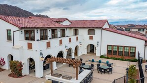 A courtyard with outdoor seating, arches, and a pergola. - PGA West Luxury Villa/palm Springs:Golf,Pool,Fitness center (La Quinta)