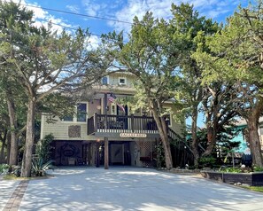 Enjoy a home away from home at Eagles Rest, featuring a balcony with a tree-lined view.