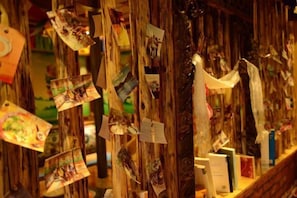 A wooden structure with photographs and books. - Spring Breeze Inn (Shangri-La)