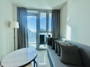 Family Apartment | Living area | 55-inch Smart TV with digital channels, TV - Uptown Parksuites 1 (Taguig)