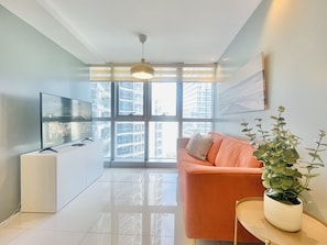 Family Apartment, 2 Bedrooms | Living area | 55-inch Smart TV with digital channels, TV