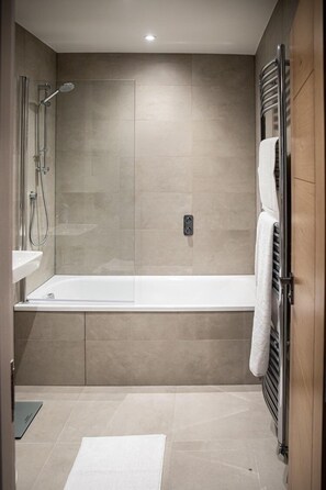Shower, hair dryer, towels, soap