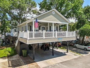 A single-story house with a porch, an American flag, and a sign that reads 'Buch Haven.' - Upscale Beach House-Linens|Golf Cart|Quiet Area (Myrtle Beach)
