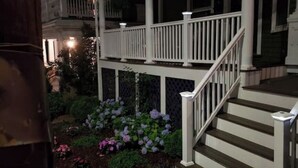 A staircase with white railings leading to a porch with a white balustrade. - Centrally located in the heart of Boston near T (Boston)