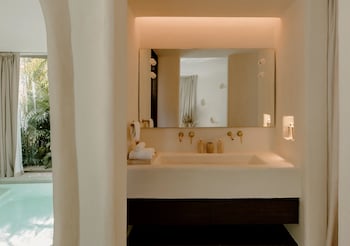Grand Room | Bathroom | Shower, rainfall showerhead, designer toiletries, hair dryer at Hotel Milam, Michelin Key winner