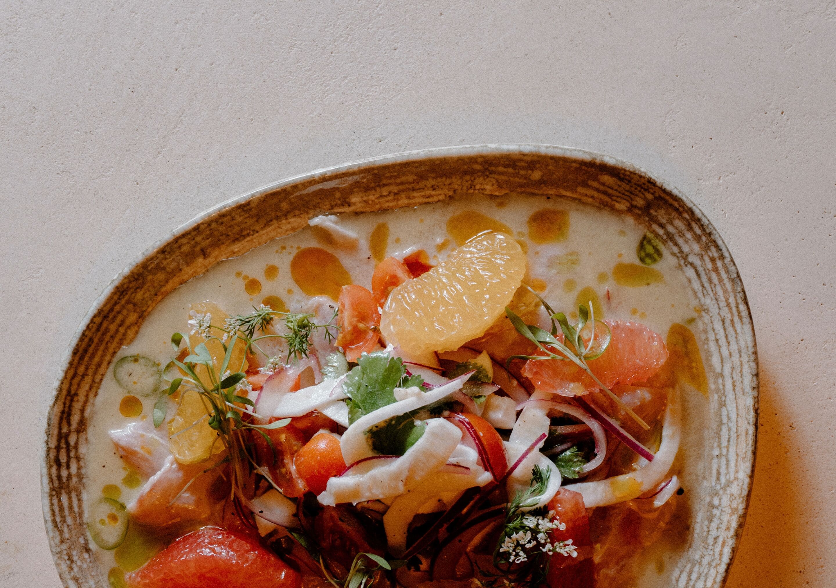 A bowl of food with various ingredients.