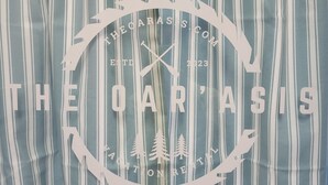 A logo with the text "THE OARASIS ESTD 2023" and a circular design with trees. - Warm northwoods beach-style apartment walking distance to OreBeGone & Mesabi Trl (Gilbert)